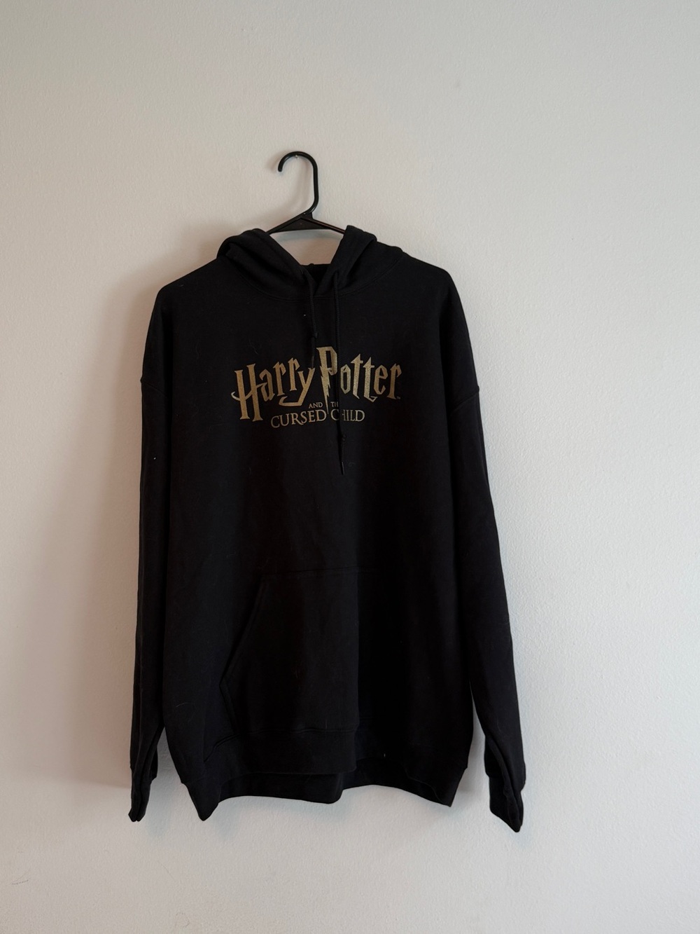 Warner Bros. Harry Potter Cursed Child Black and Gold Hoodie